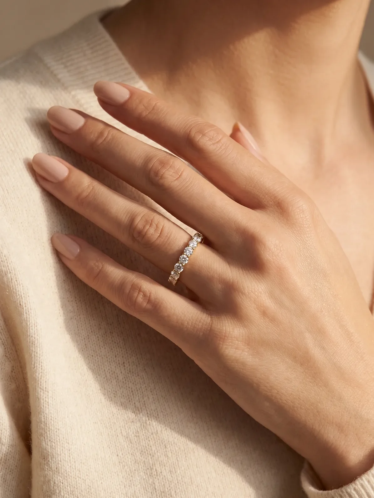 Woman wearing a full-eternity round diamond gold band ring