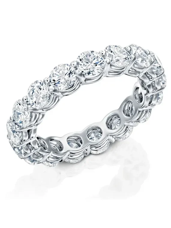 Wide diamond eternity band set with large round brilliant diamonds all the way around